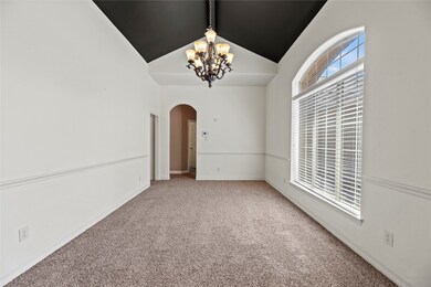 The formal dining room is to the right of the entr