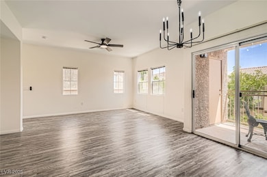 Living room with a chandelier, wood finished floor