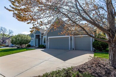 View of front of home with concrete driveway, stucco siding, and an attached garage