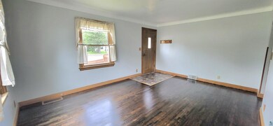 Empty room featuring dark hardwood / wood-style fl