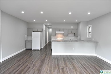 Living rm & eating area looking into kitchen area.