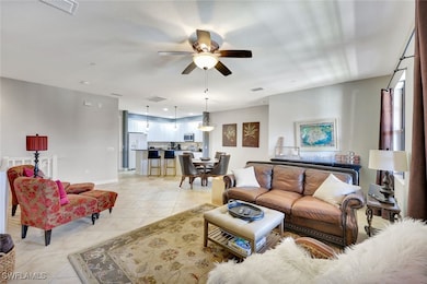 Living room with light tile patterned floors, a ce