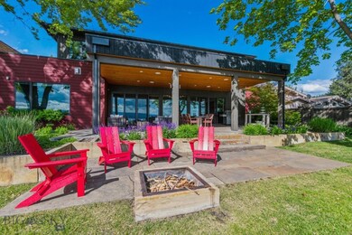 View of patio with a fire pit
