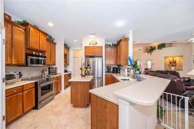 The spacious eat-in Kitchen has corian, solid wood