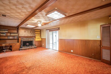 Unfurnished living room with carpet floors, wainsc