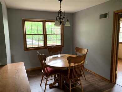 Dining area with a table that is now gone.  It fits really well with room to spare!