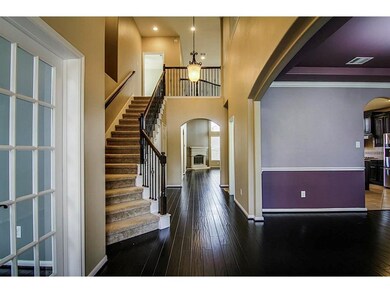 Discover an elegant entryway featuring a grand sta