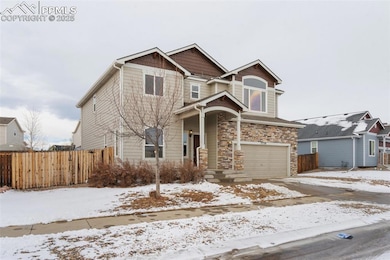 View of front of property featuring a garage
