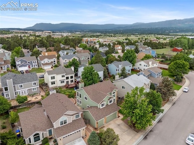 Aerial view of residential area with a mountain backdrop