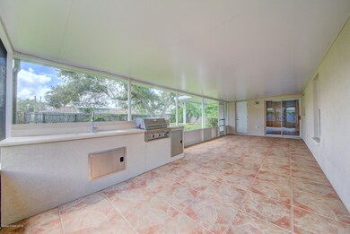 screened back porch with summer kitchen