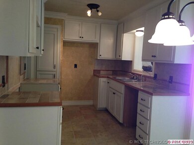 Remodeled Kit. new cabinets, floor, travertine cou