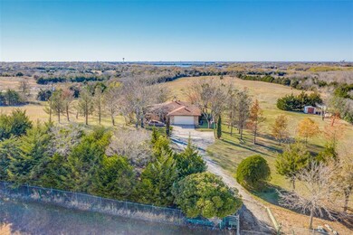 This home features fully enclosed perimeter fencing, country acreage views and beautifully renovated interior.