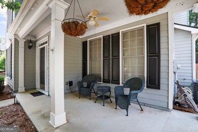 Charming front porch with a cozy sitting area, perfect for relaxing with a book or enjoying a quiet evening breeze