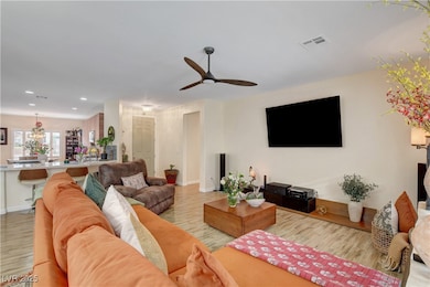 Living area featuring light wood-style floors, a c