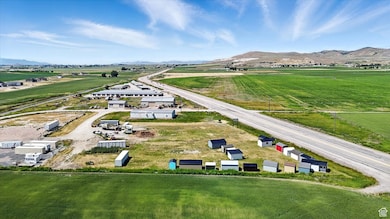 Overview of rural landscape featuring a mountainous background