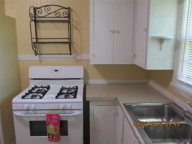 Cute kitchen with built in cabinets