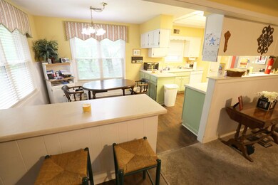 Breakfast room off kitchen, dark hardwood / wood-s