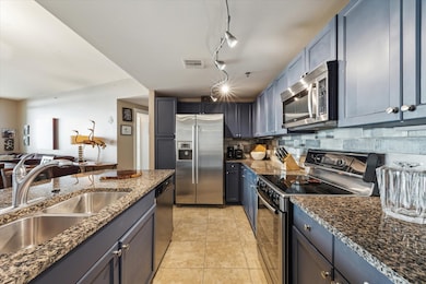 The stylish kitchen boasts sleek stainless steel a