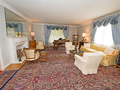 Living room with decorative marble fireplace