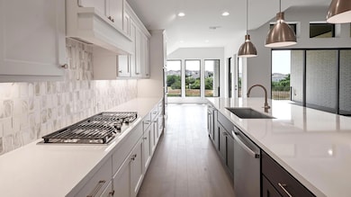Kitchen with appliances with stainless steel fini