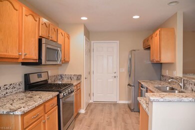 Updated kitchen with granite countertops.