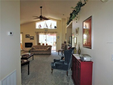 entry walks into living room with view of pool are