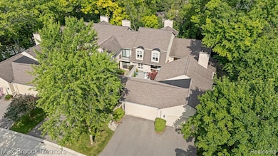 Surrounded by mature trees front and back. . .