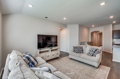 The doorway to the left heads to the primary bedroom, and the hallway to the right leads to the foyer, first 3 bedrooms, laundry room, garage, and full bathroom.