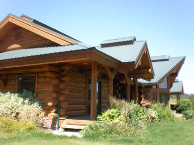 Front of home, large logs, great decks