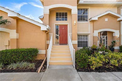 Doorway to property with stucco siding