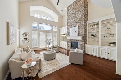 Living room boasts 2-story cathedral ceilings and