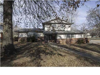 Unique home on a corner lot! Large trees and sidel