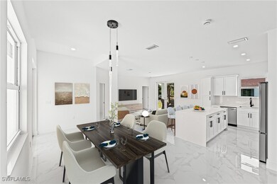 Dining area with light marble finish floors and re