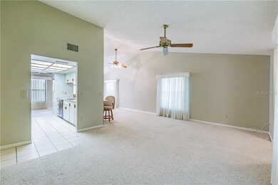 View of Living room leading into the kitchen.