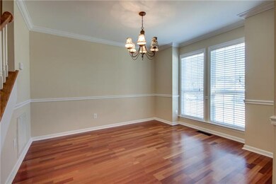 The dining room features hardwood floors and fresh paint.  This room would work well as an office, if needed.