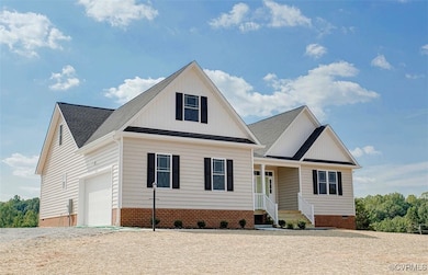 View of similar home featuring a porch and a garag