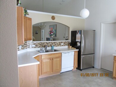 Spacious Kitchen with Tile Backsplash