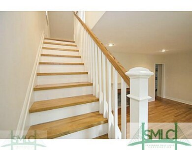 Den/Family/Great Room. Gorgeous stairway with wood