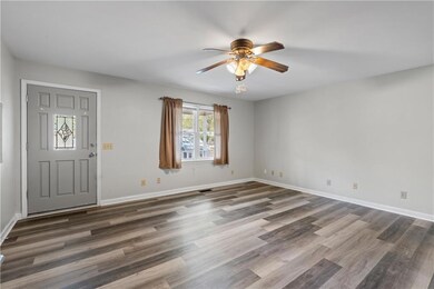 Entrance foyer with wood finished floors, ceiling 