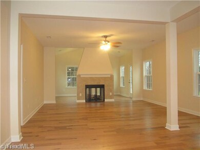 Living Room. SIMILAR PHOTO - Living Room with STANDARD fireplace (**this photo shows OPTIONAL sunroom with double sided fireplace - call LA for pricing**