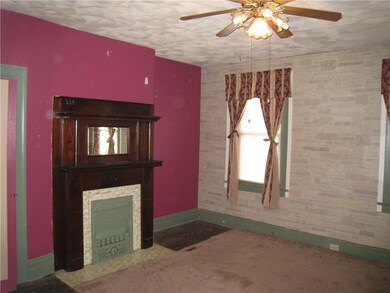 Large Master Bedroom with decorative fireplace.