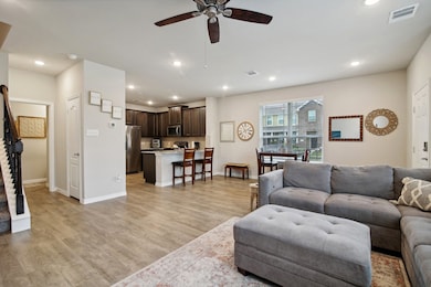 Enjoy an open-concept living, kitchen, and dining