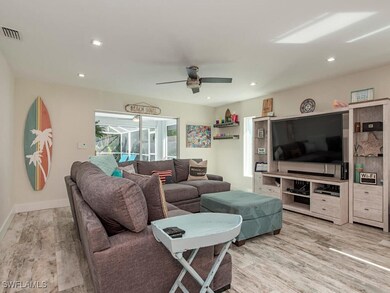 Living room with light hardwood / wood-style floor