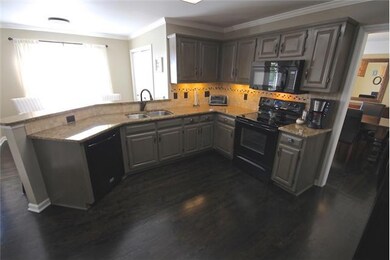 Open Kitchen with Painted Cabinets, Granite Countertops and Update Appliances