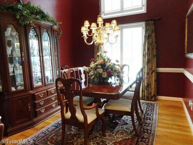 Dining Room. Vaulted ceilings and plantation shutters througout