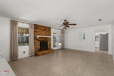 Unfurnished living room featuring a fireplace, fre