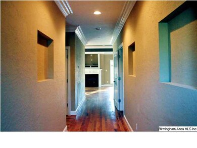 A grand hallway is the entrance to this lovely hom
