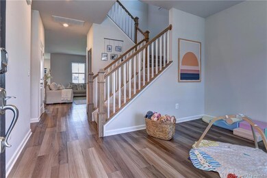 Foyer opens to a keeping room/formal living room.