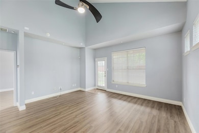 Spare room with a ceiling fan, light wood-type fl