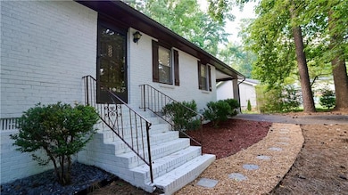 Doorway to property with brick siding